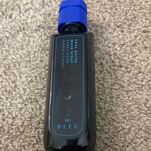 R+Co BLEU Rose Water Wave Spray — Black Bottle with Blue Accents